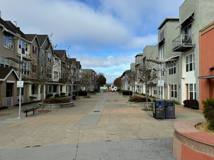 Townhouses lining a pedestrian plaza along Nevin Avenue in the Richmond Transit Village.